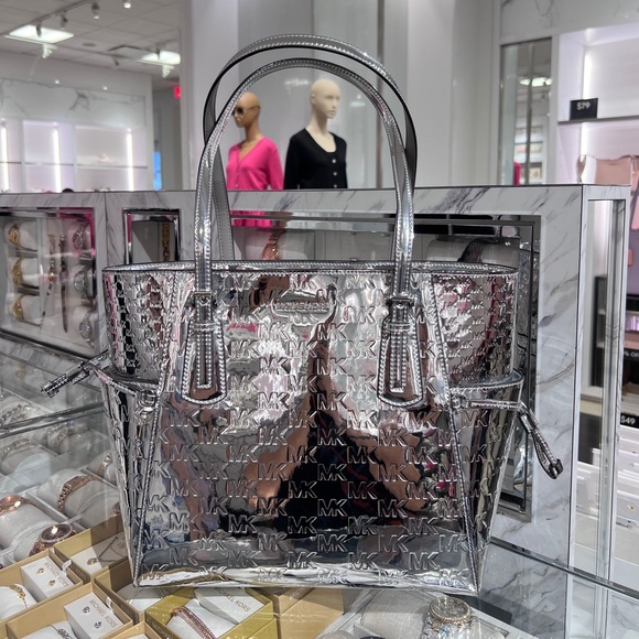 Michael Kors Handbags - MICHAEL KORS Voyager Large Patent Logo Debossed Tote Bag NWT Silver